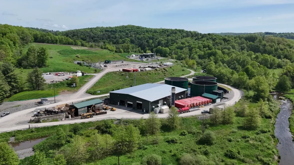 alkaLi’s Lithium extraction site with storage tanks, trailers, and forested surroundings in Pennsylvania.